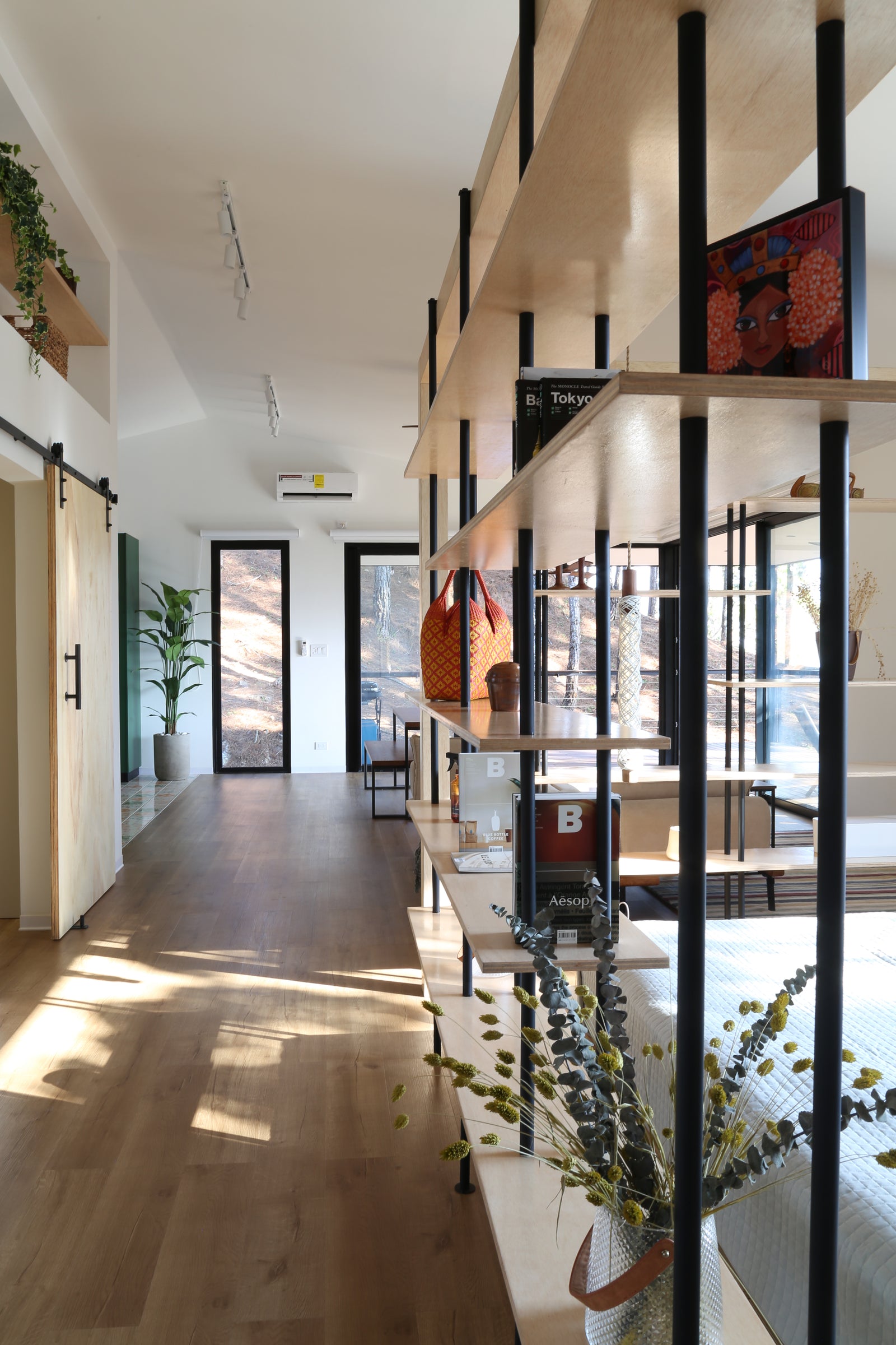 The plan is open throughout, so the furniture does the dividing.