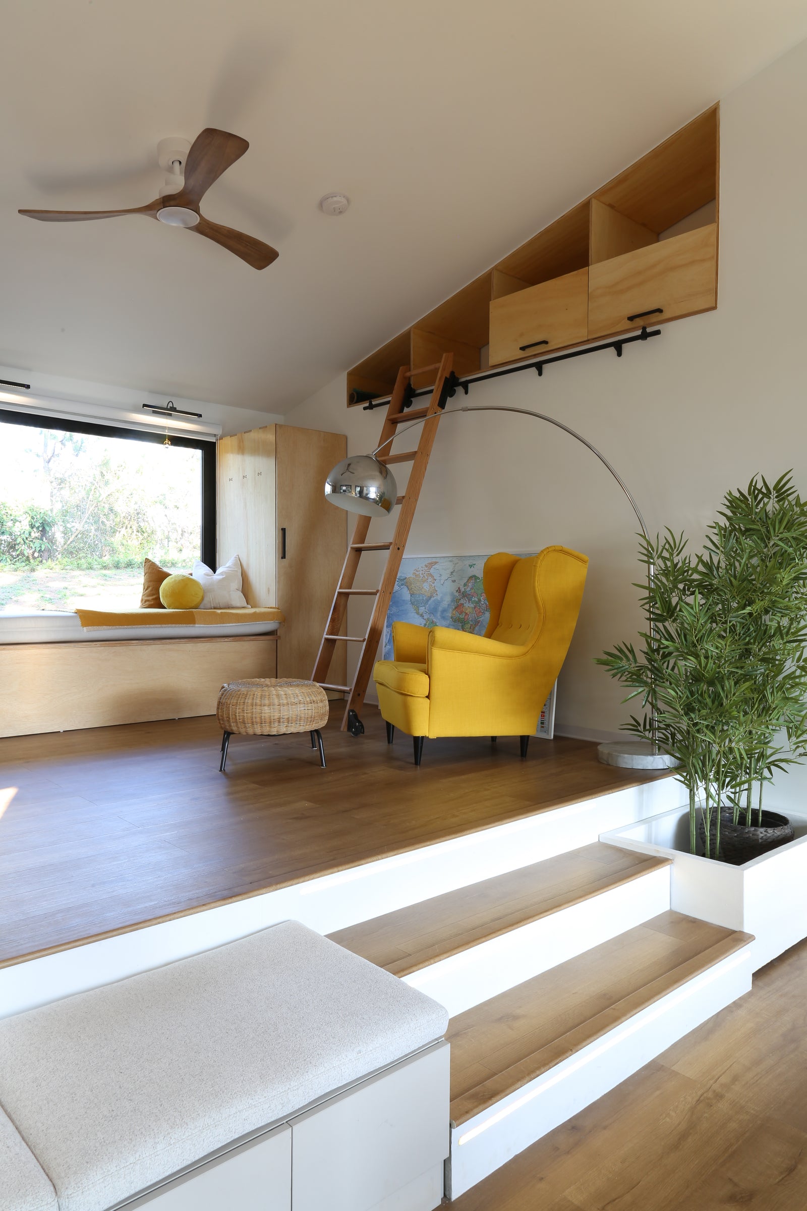 The plan is open throughout, so the furniture does the dividing.