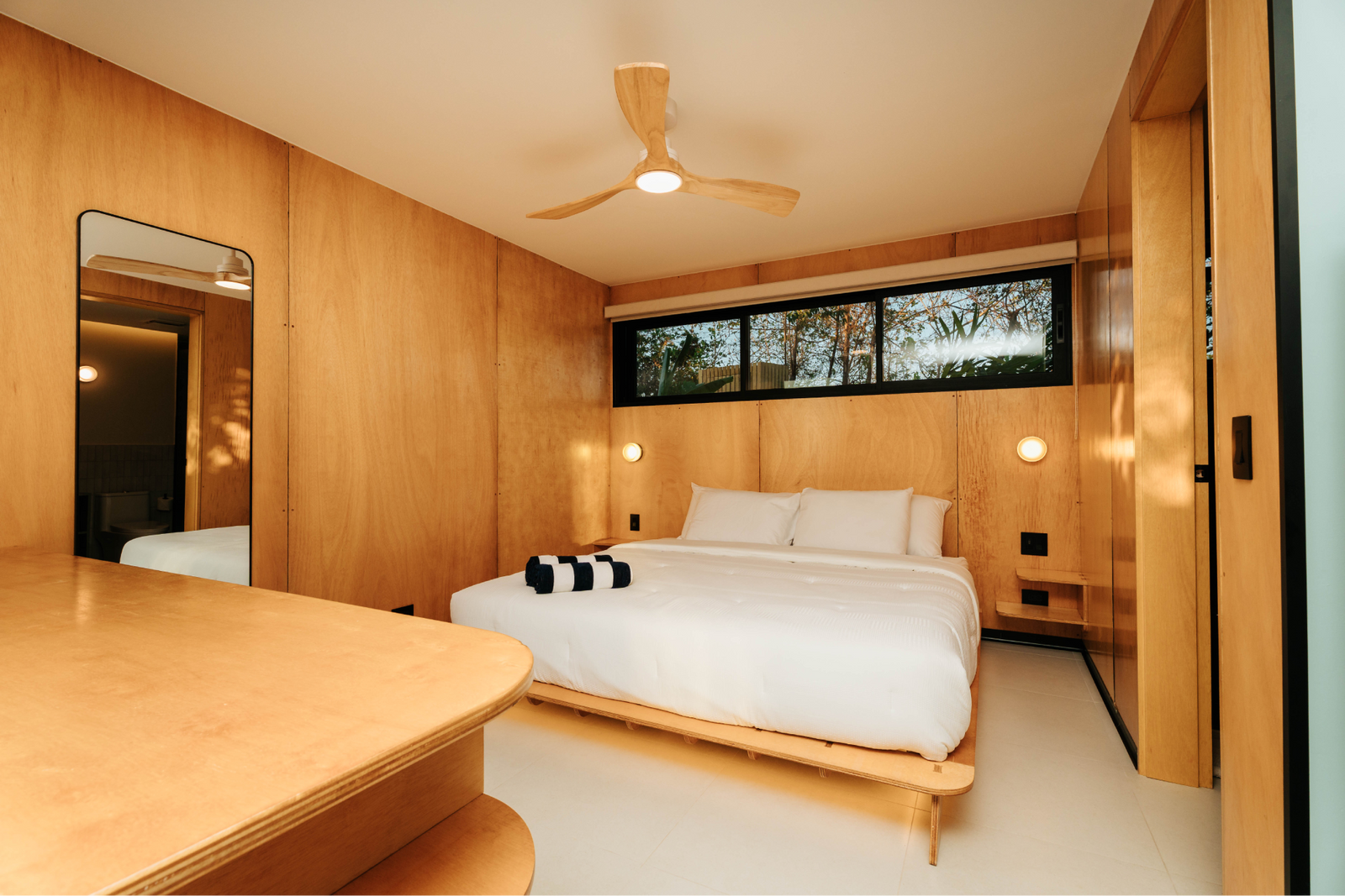 The plan is open throughout, so the furniture does the dividing.
